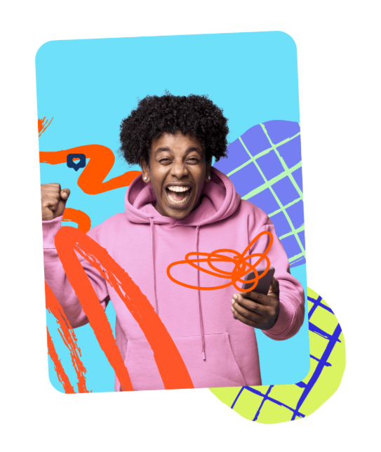 Creator in a pink hoodie celebrating while holding his phone